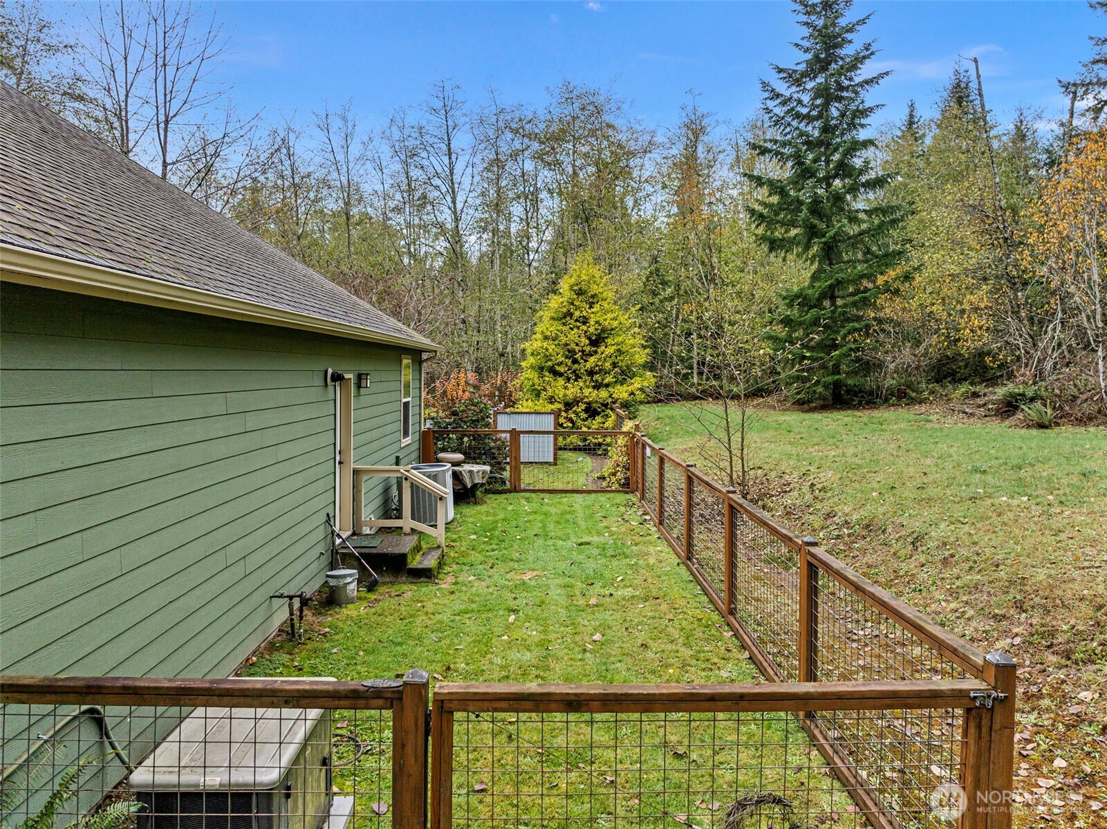 10574 Sidney Road Southwest Port Orchard, WA 98367 - Photo 26 of 37 a view of a backyard with sitting area