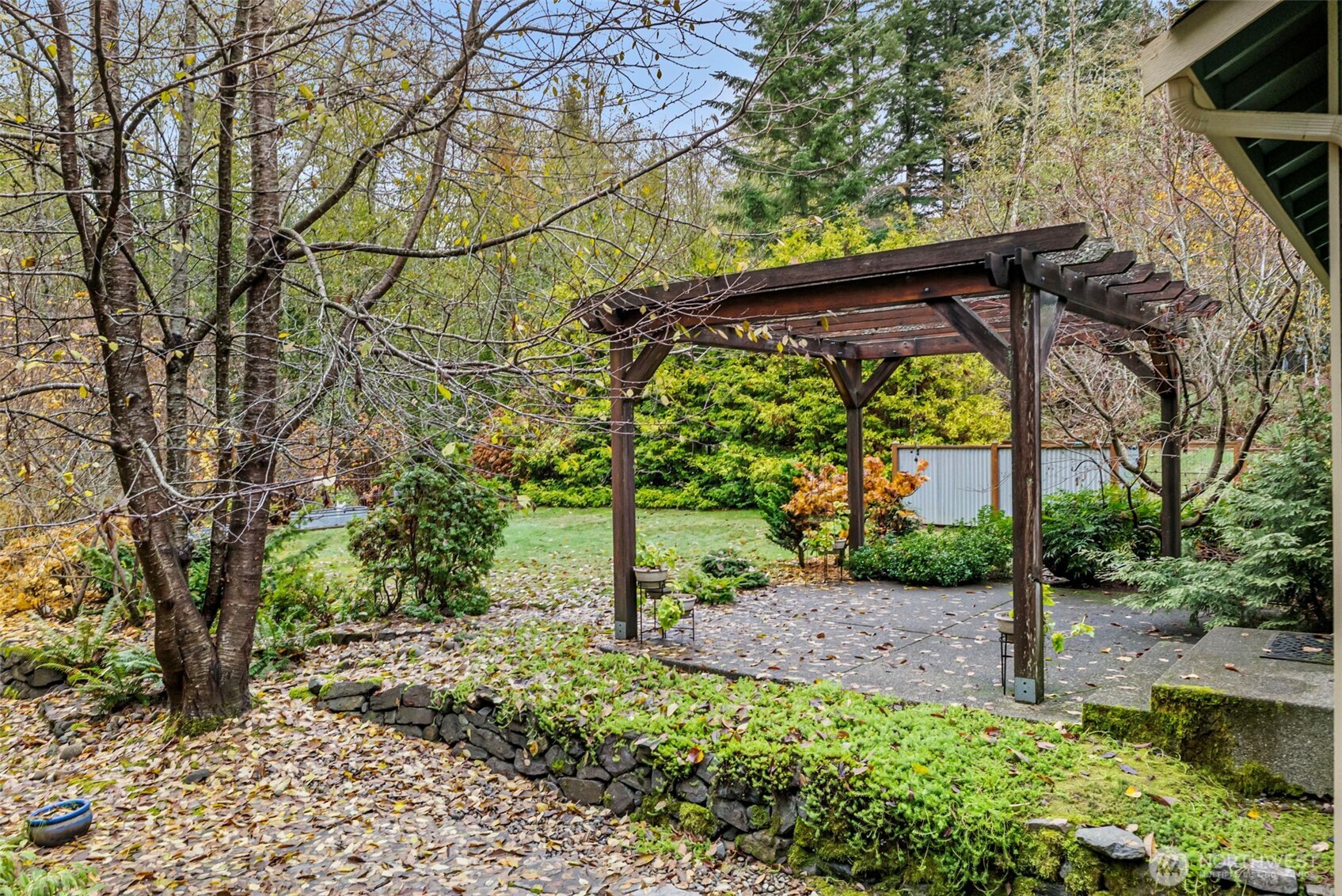 10574 Sidney Road Southwest Port Orchard, WA 98367 - Photo 27 of 37 a view of a yard with a tree