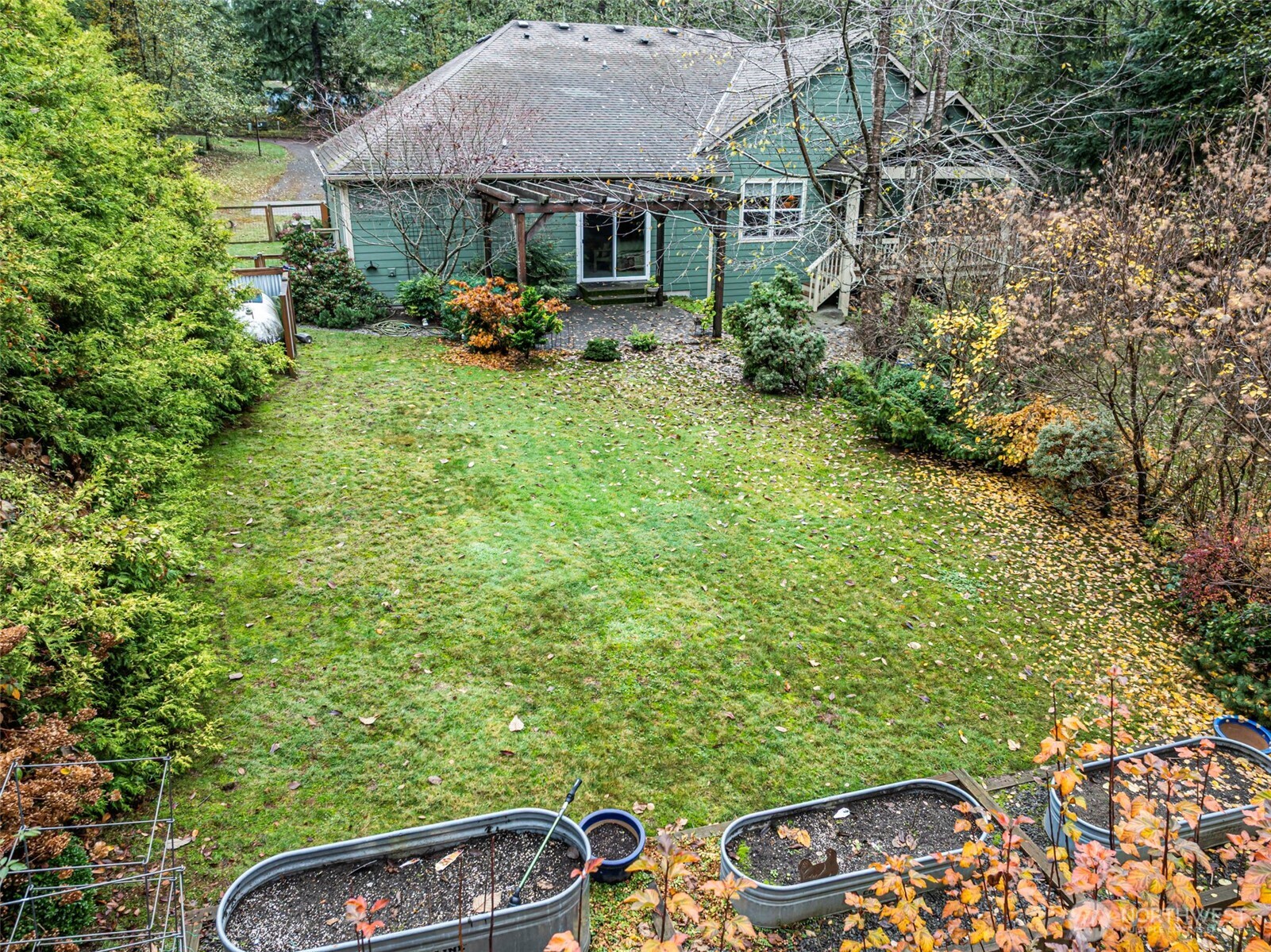 10574 Sidney Road Southwest Port Orchard, WA 98367 - Photo 29 of 37 a backyard of a house with seating space