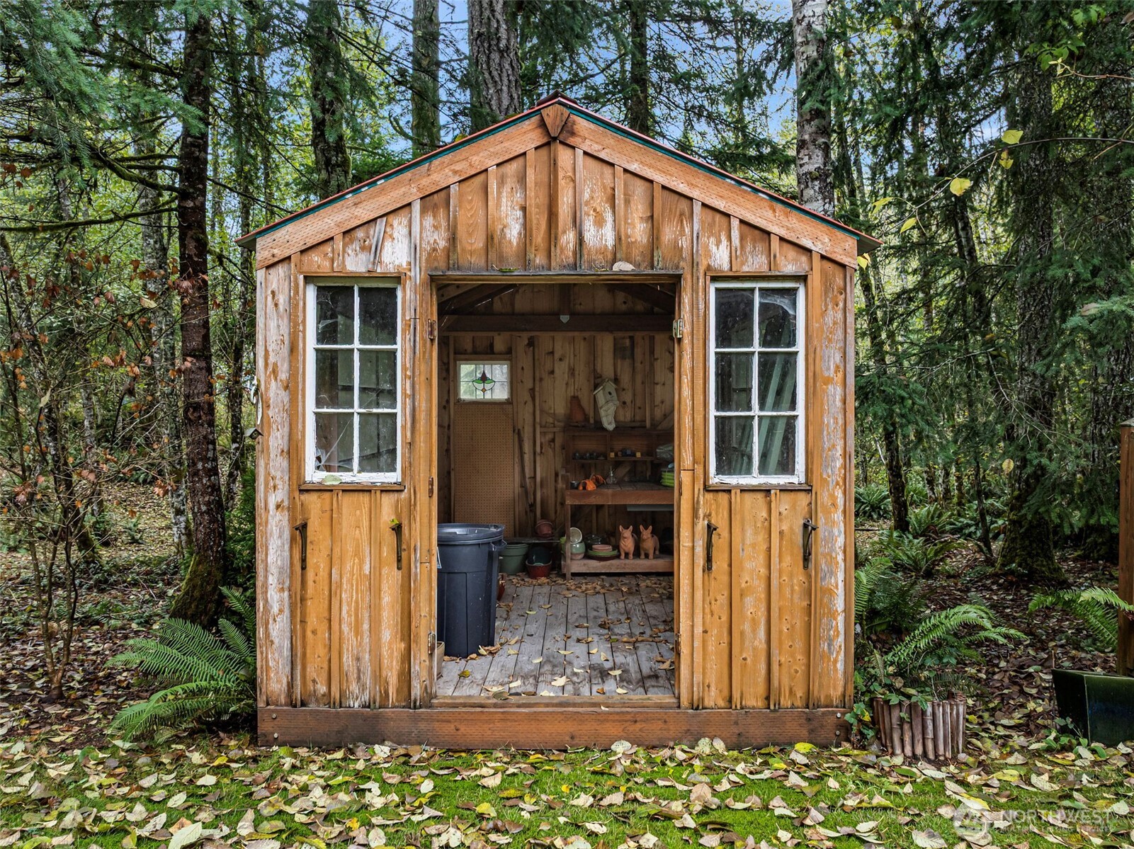 10574 Sidney Road Southwest Port Orchard, WA 98367 - Photo 31 of 37 a front view of a house with garden