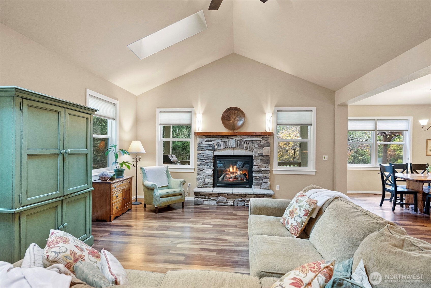 10574 Sidney Road Southwest Port Orchard, WA 98367 - Photo 4 of 37 a living room with furniture and a fireplace