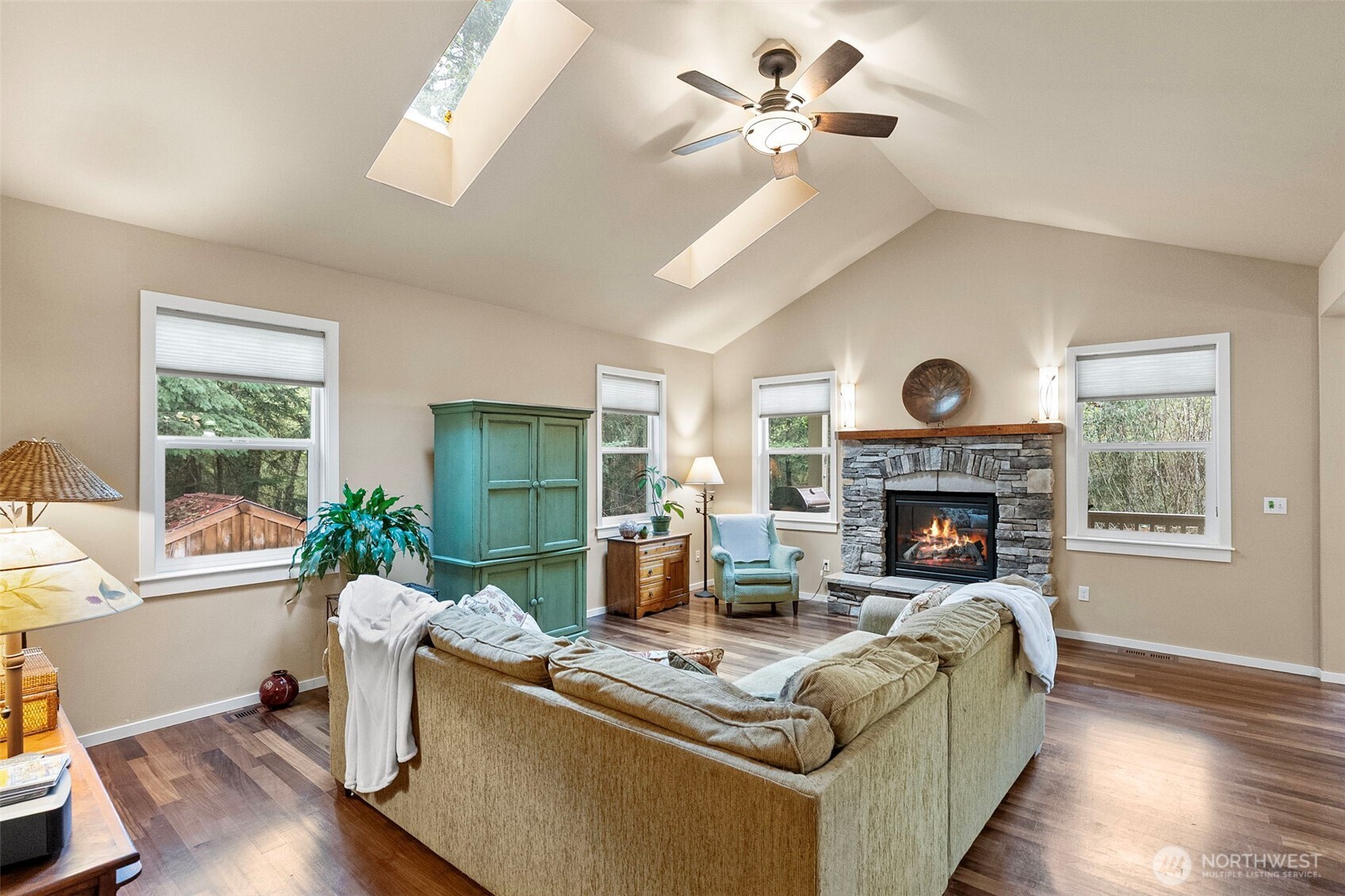 10574 Sidney Road Southwest Port Orchard, WA 98367 - Photo 5 of 37 a living room with furniture and a fireplace