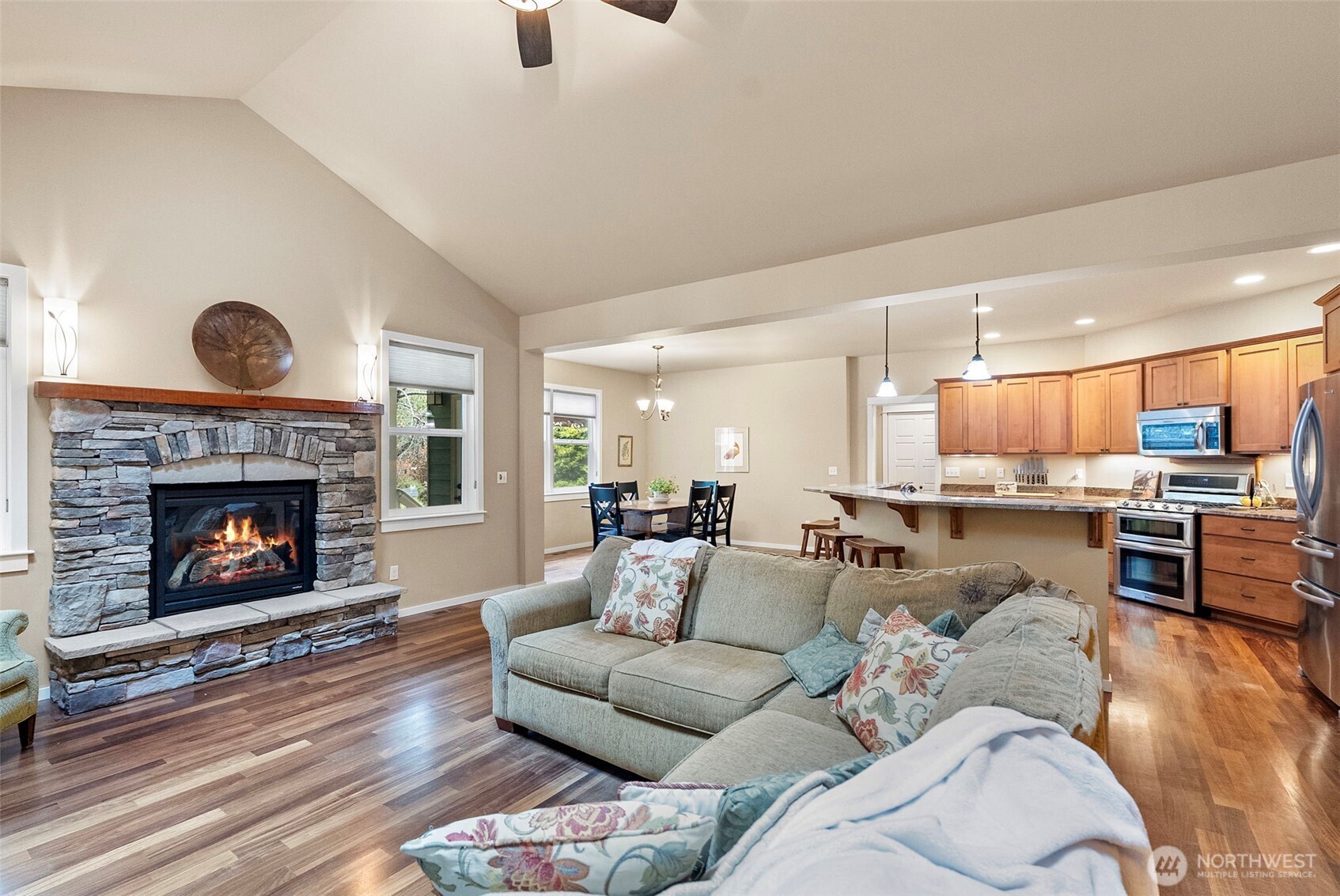 10574 Sidney Road Southwest Port Orchard, WA 98367 - Photo 6 of 37 a living room with furniture and a fireplace
