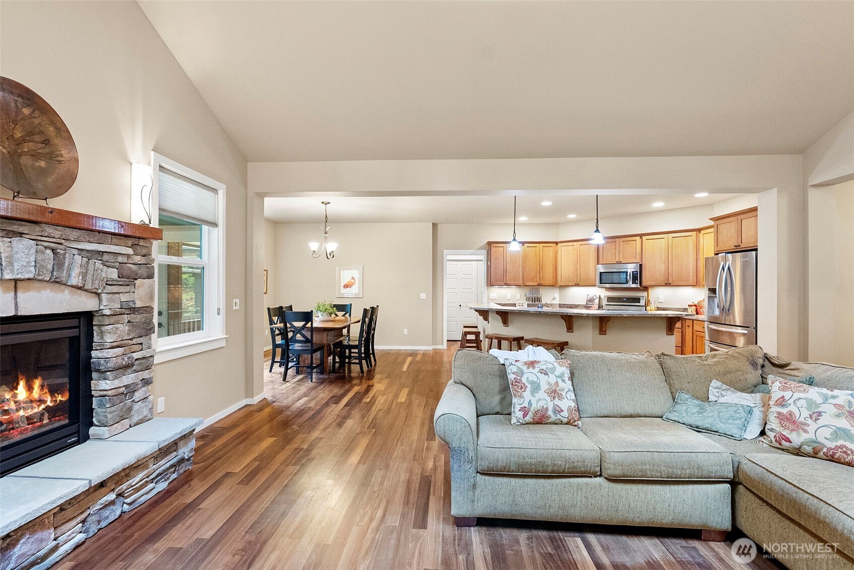 10574 Sidney Road Southwest Port Orchard, WA 98367 - Photo 7 of 37 a living room with furniture and a fireplace