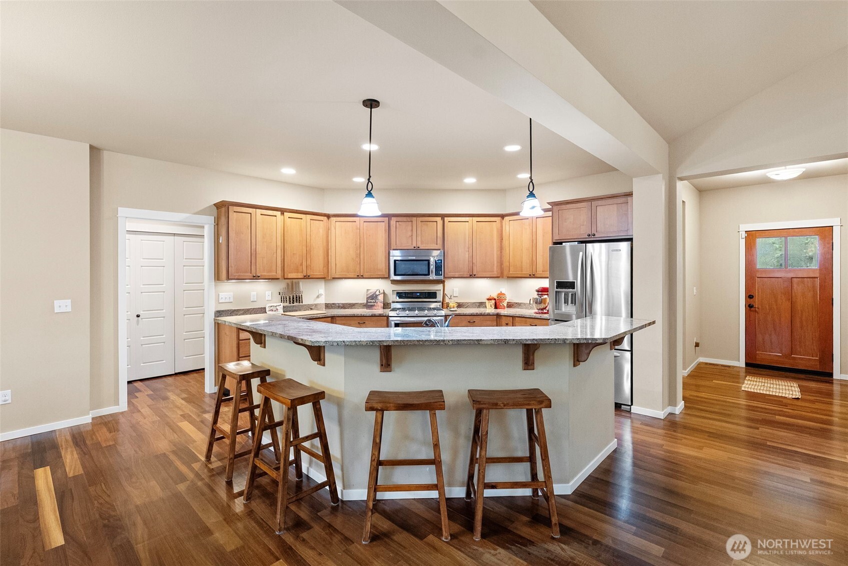 10574 Sidney Road Southwest Port Orchard, WA 98367 - Photo 8 of 37 a kitchen with a table and chairs in it