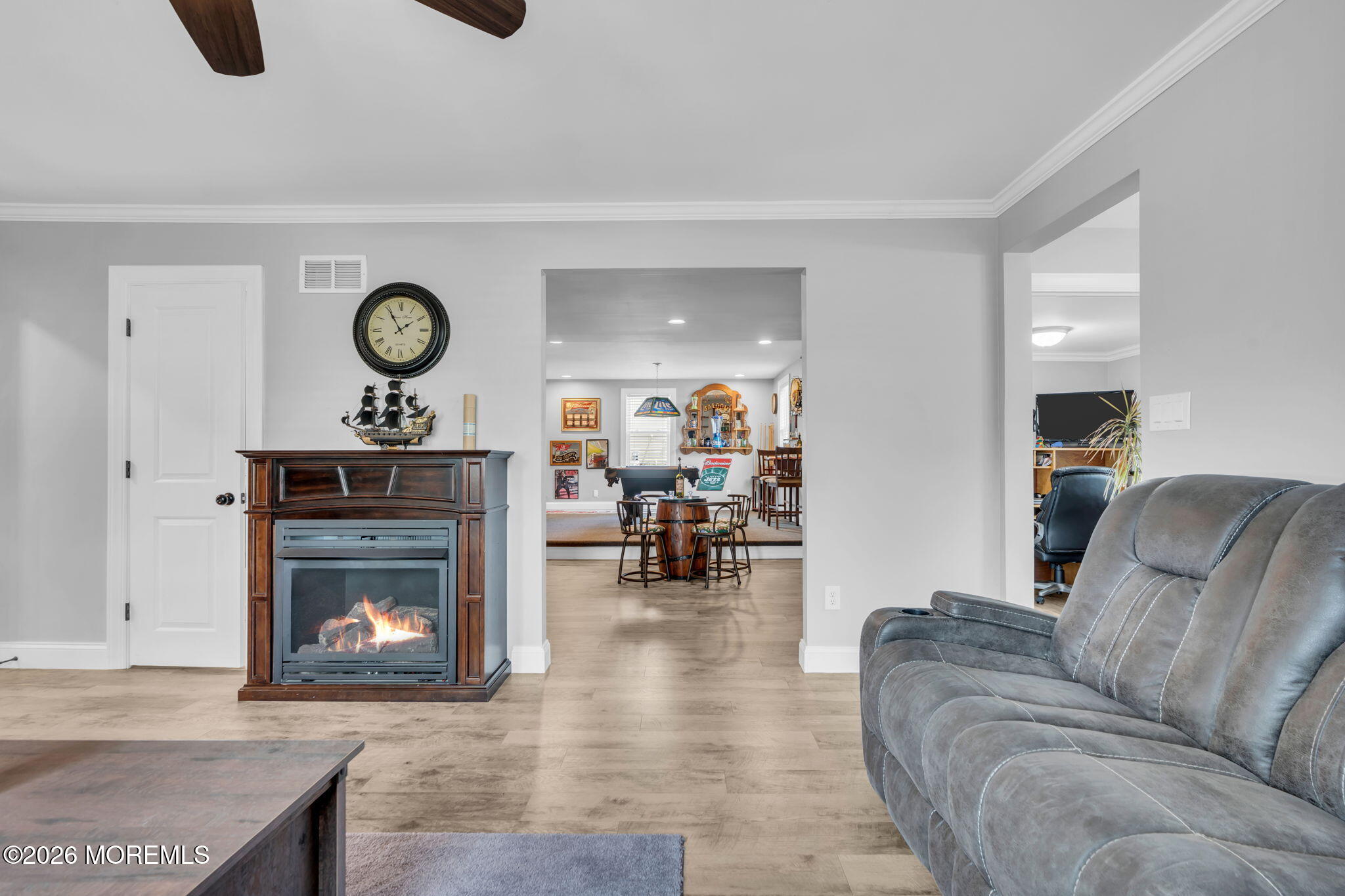 181 Locust Avenue Howell, NJ 07731 - Photo 13 of 66 a living room with furniture and a fireplace