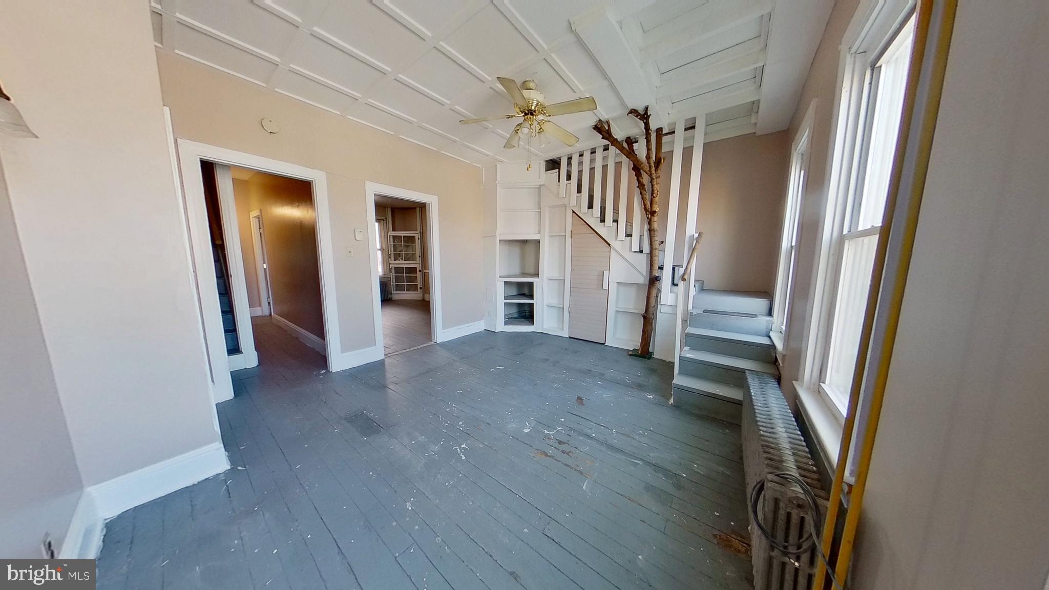 702 West Philadelphia Street, Unit 2 York, PA 17401 - Photo 6 of 10 a view of a hallway with wooden floors and stairs
