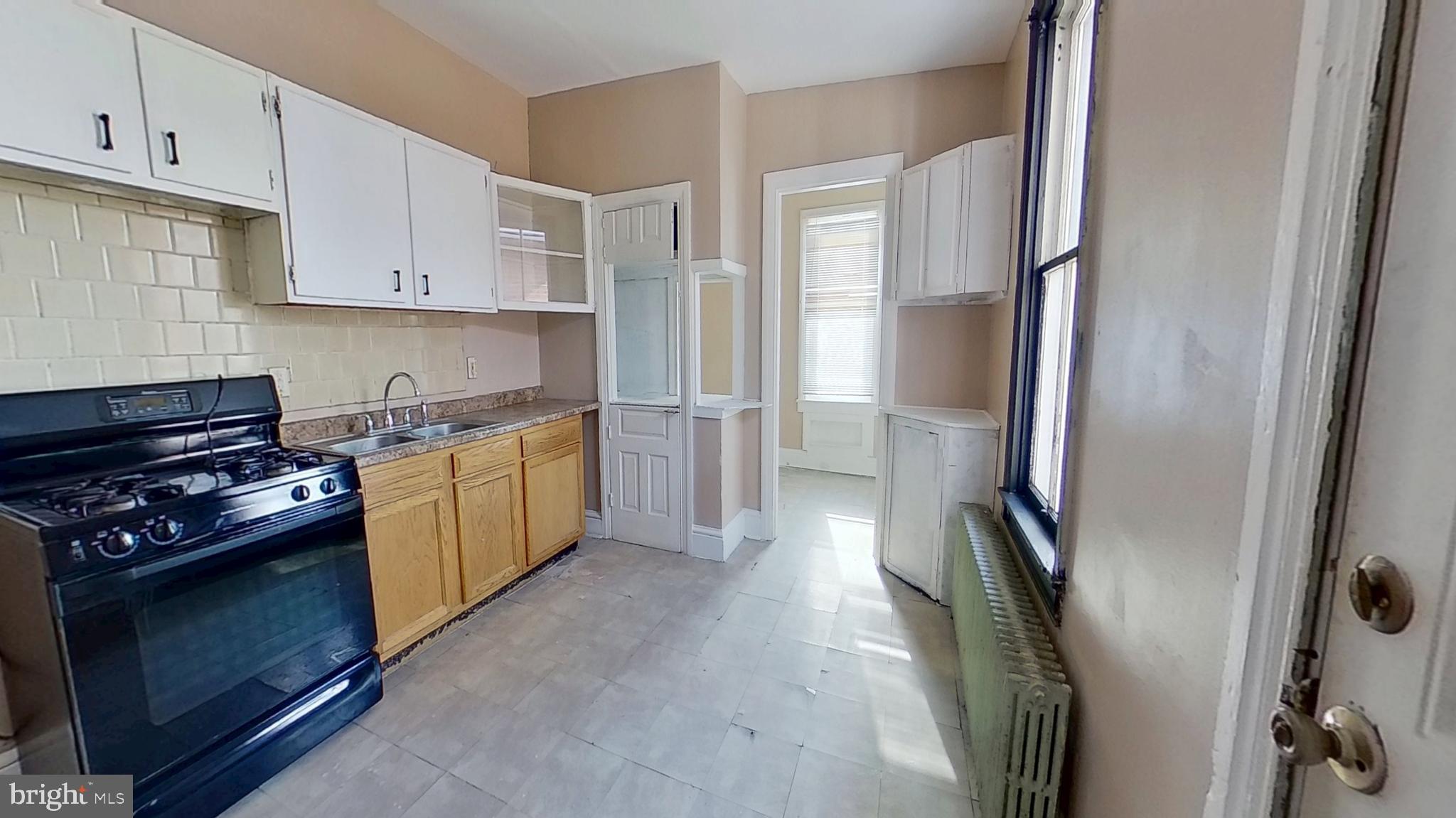 702 West Philadelphia Street, Unit 2 York, PA 17401 - Photo 10 of 10 a kitchen with stainless steel appliances granite countertop a refrigerator a stove and a sink