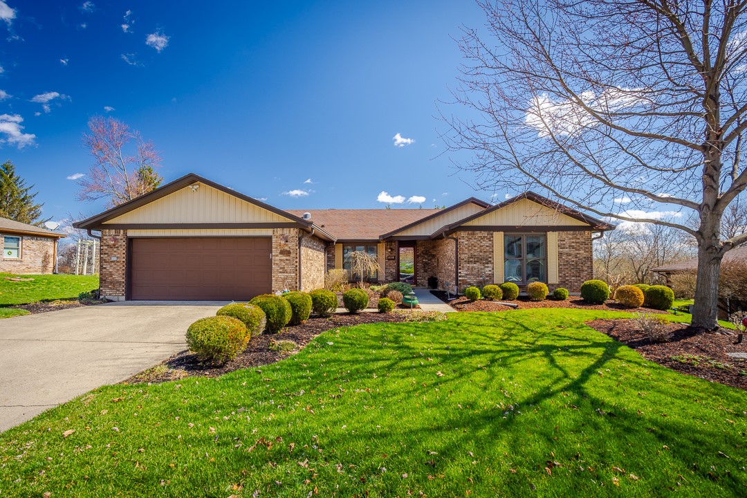 540 Basil Street Springboro, OH 45066 - Photo 14 of 32 This charming residence features a well-manicured lawn, a garage, and a welcoming front entrance.