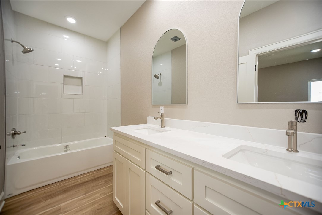 74 Whooping Crane Street Port O'Connor, TX 77982 - Photo 21 of 43 a bathroom with a sink and a bathtub