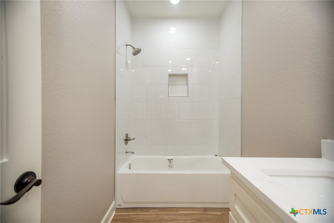 74 Whooping Crane Street Port O'Connor, TX 77982 - Photo 22 of 43 a bathroom with a bathtub and shower