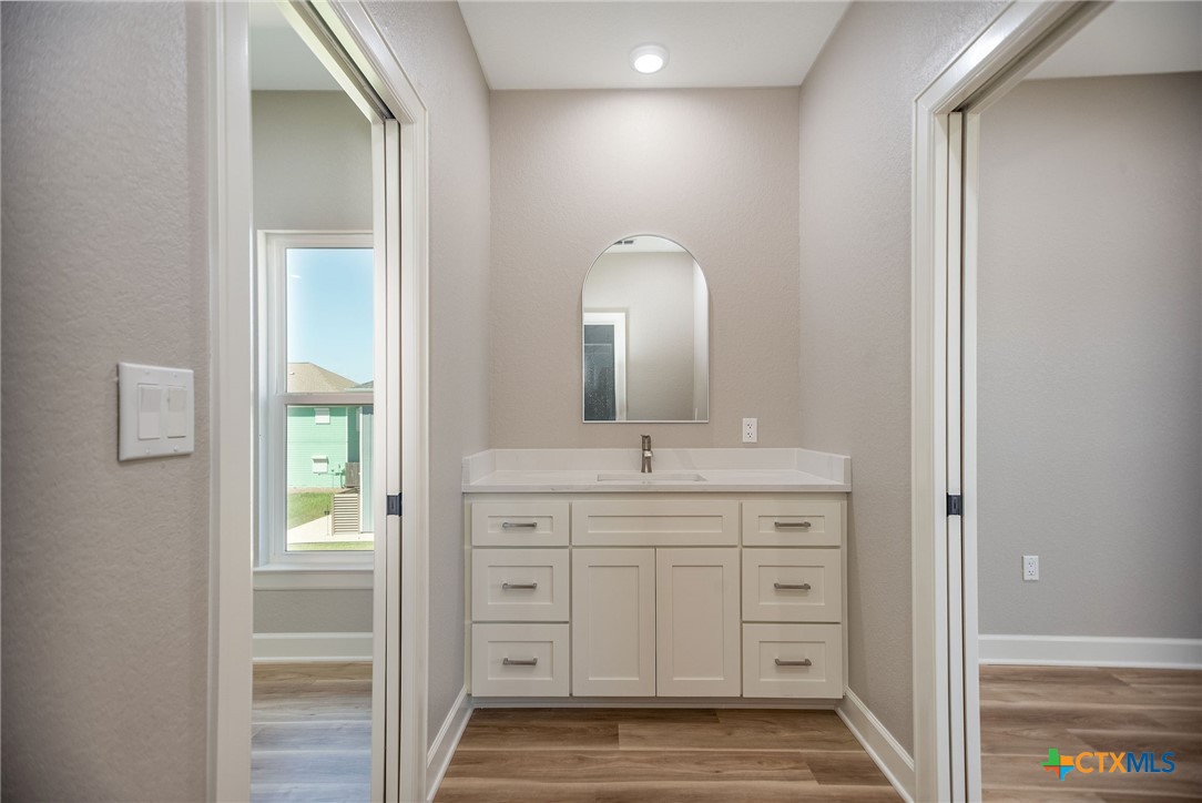 74 Whooping Crane Street Port O'Connor, TX 77982 - Photo 25 of 43 a bathroom with a sink and a mirror