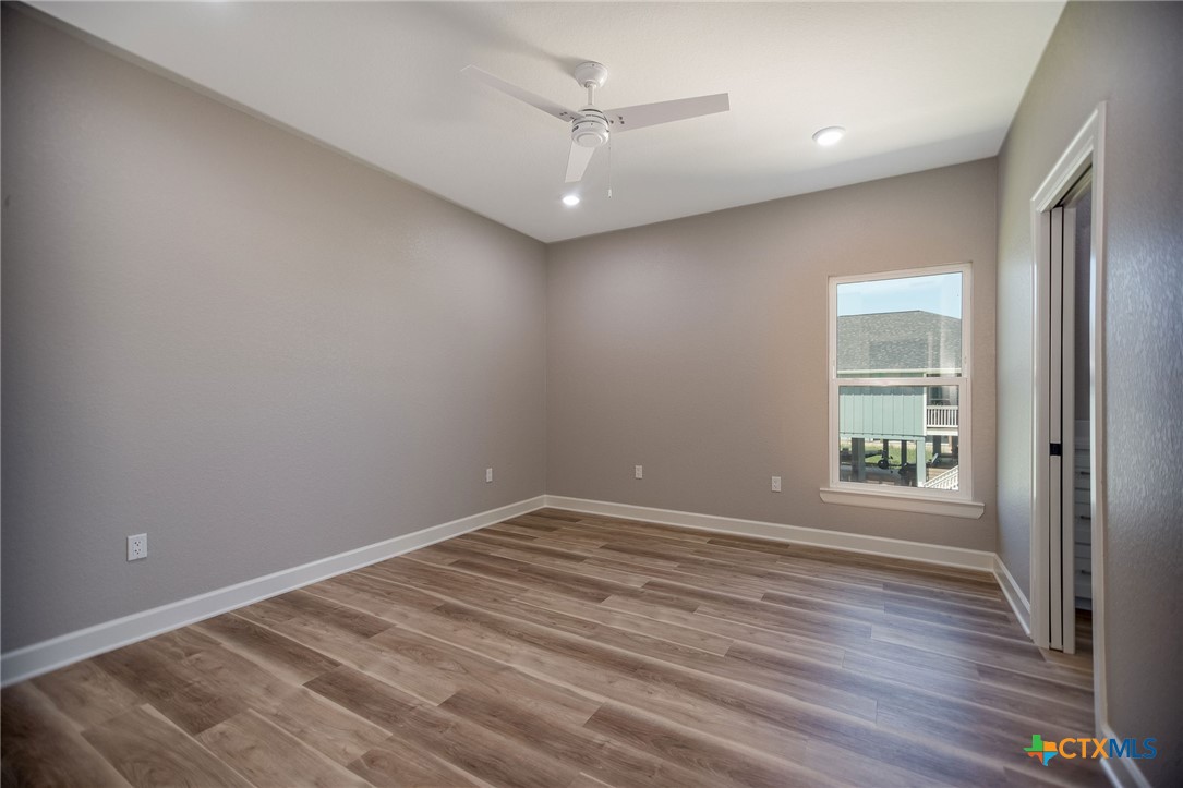 74 Whooping Crane Street Port O'Connor, TX 77982 - Photo 28 of 43 an empty room with windows and closet