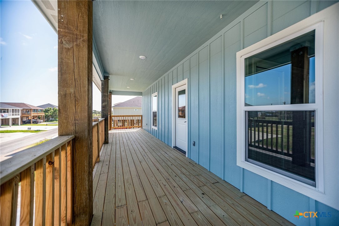 74 Whooping Crane Street Port O'Connor, TX 77982 - Photo 3 of 43 a view of hallway with wooden floor