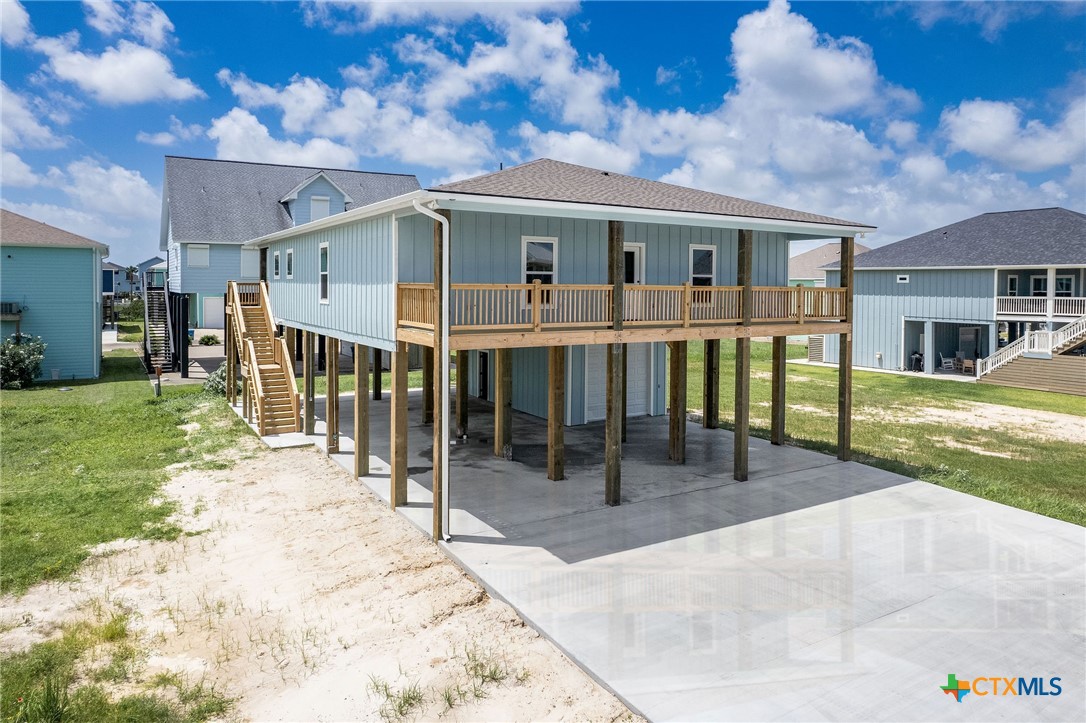 74 Whooping Crane Street Port O'Connor, TX 77982 - Photo 42 of 43 a view of a house with a porch and furniture
