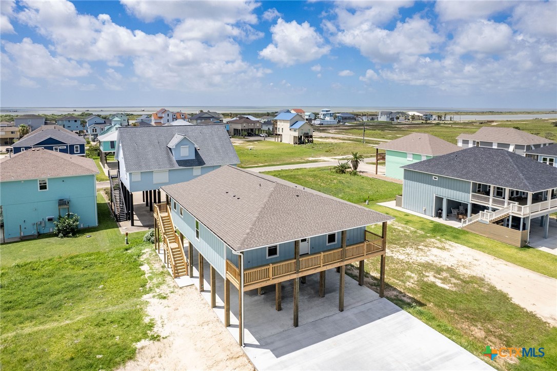 74 Whooping Crane Street Port O'Connor, TX 77982 - Photo 43 of 43 an aerial view of a house with big yard