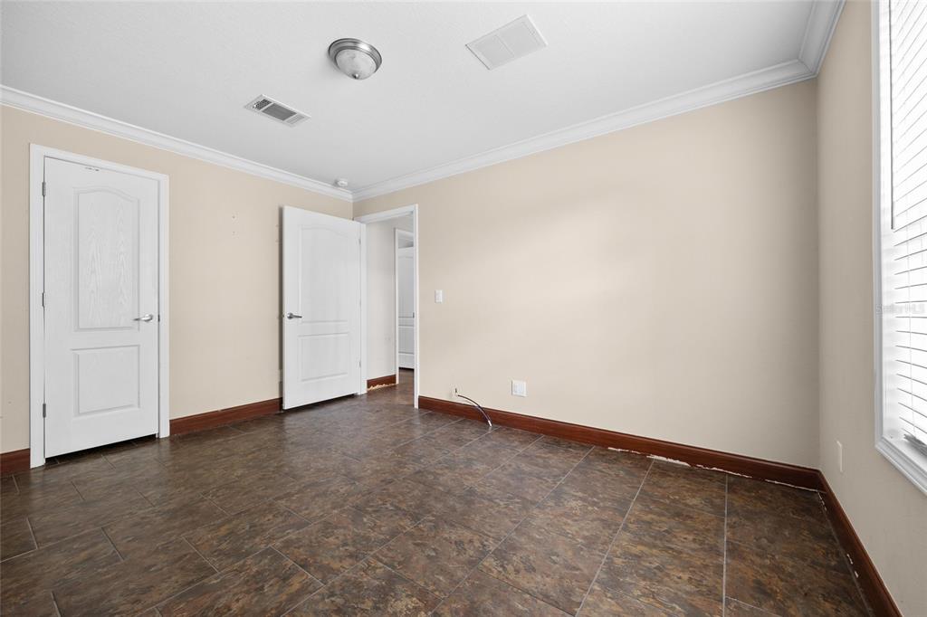 240 Swan Lake Road Melrose, FL 32666 - Photo 14 of 44 an empty room with windows and closet