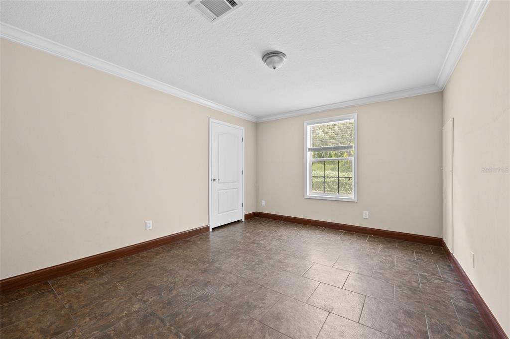 240 Swan Lake Road Melrose, FL 32666 - Photo 16 of 44 an empty room with windows