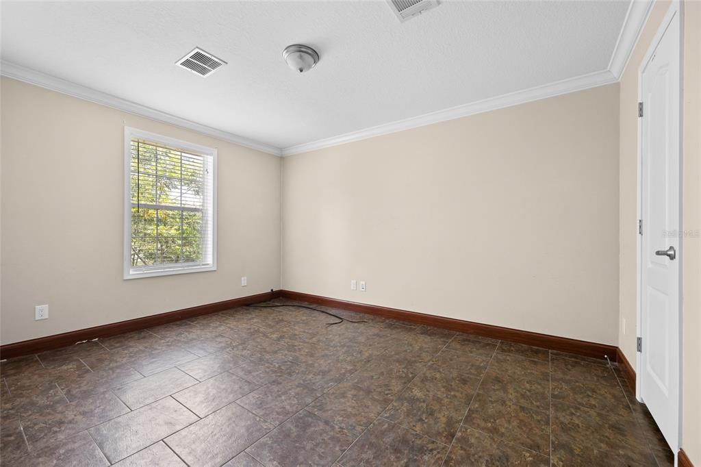 240 Swan Lake Road Melrose, FL 32666 - Photo 17 of 44 a view of an empty room with a window