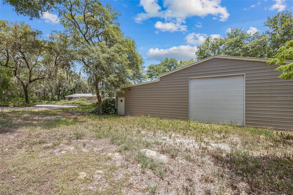 240 Swan Lake Road Melrose, FL 32666 - Photo 23 of 44 a backyard of a house with lots of green space