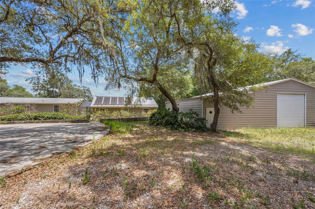 240 Swan Lake Road Melrose, FL 32666 - Photo 26 of 44 a view of a house with a yard