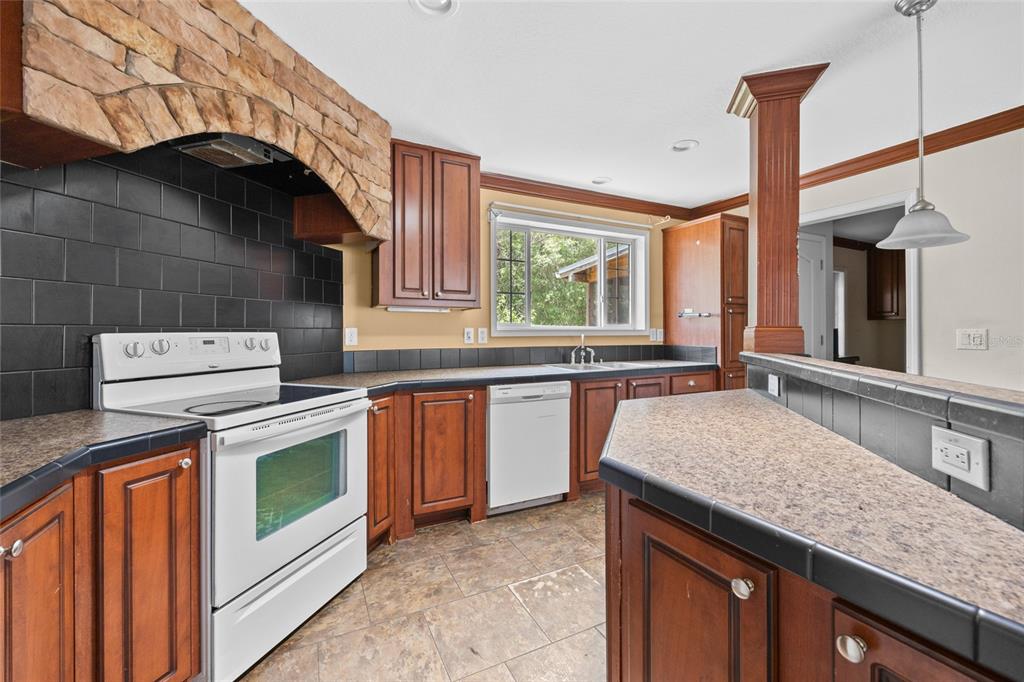 240 Swan Lake Road Melrose, FL 32666 - Photo 3 of 44 a kitchen with a stove and a sink
