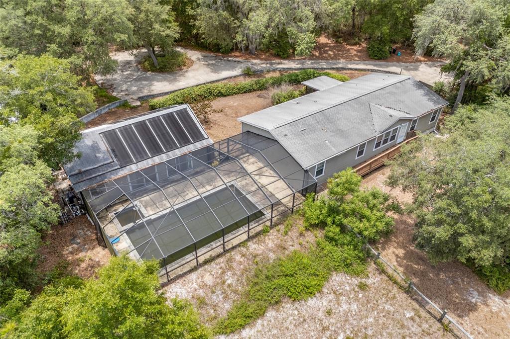 240 Swan Lake Road Melrose, FL 32666 - Photo 31 of 44 a view of a backyard with a yard