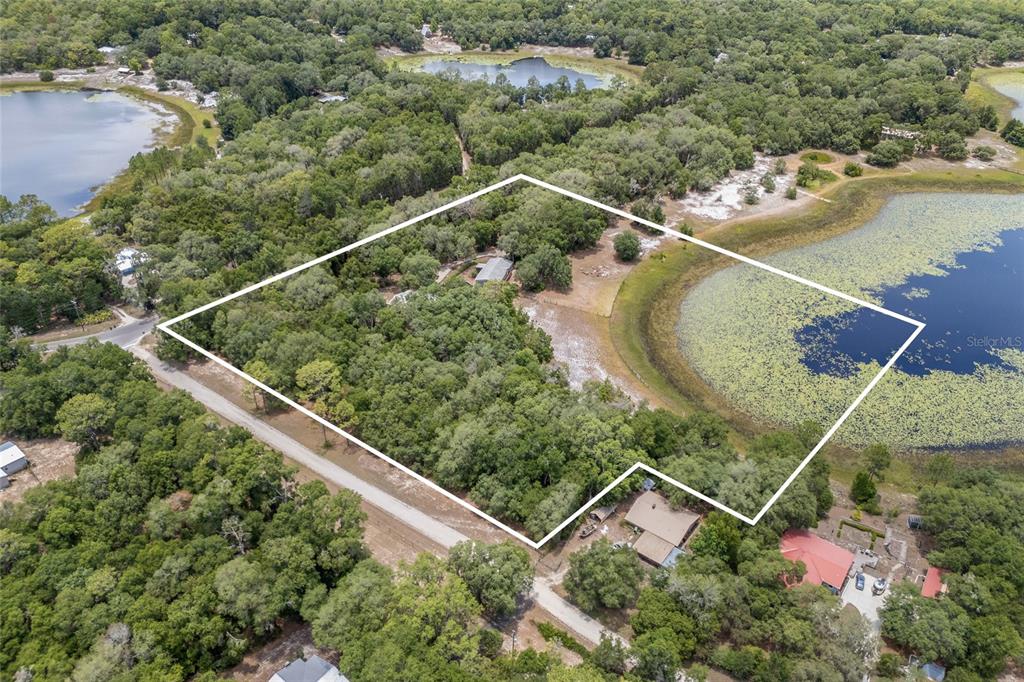 240 Swan Lake Road Melrose, FL 32666 - Photo 38 of 44 an aerial view of a house with a lake view