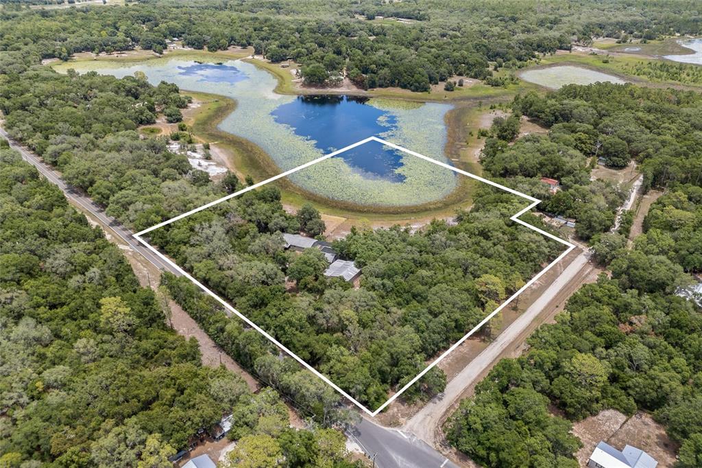 240 Swan Lake Road Melrose, FL 32666 - Photo 40 of 44 a view of a lake from a window