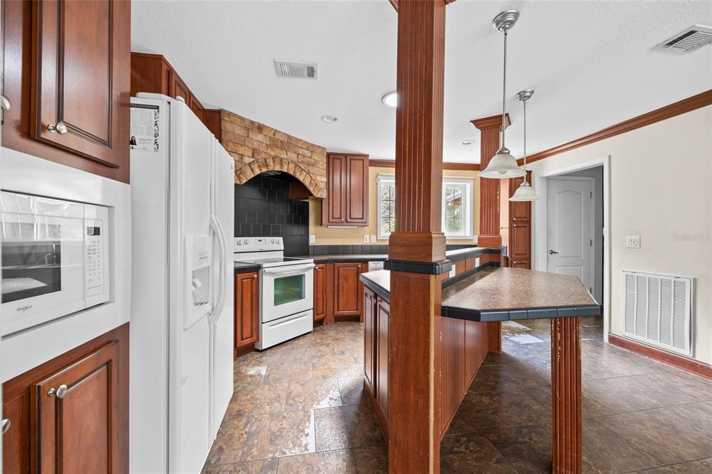 240 Swan Lake Road Melrose, FL 32666 - Photo 4 of 44 a kitchen view with cabinets and stove