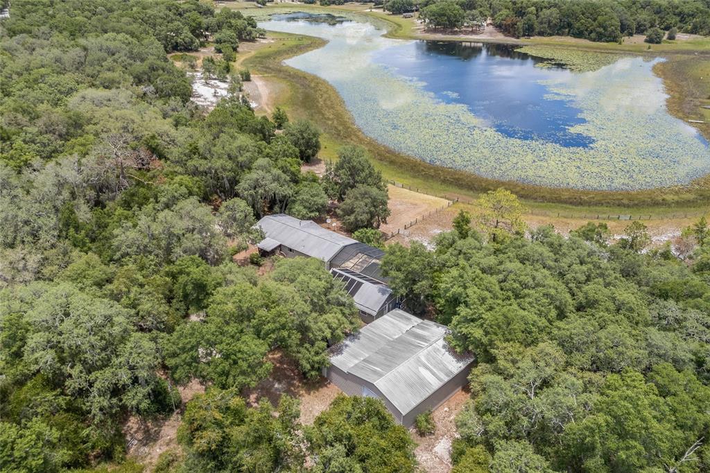 240 Swan Lake Road Melrose, FL 32666 - Photo 44 of 44 an aerial view of a house with a yard and lake view