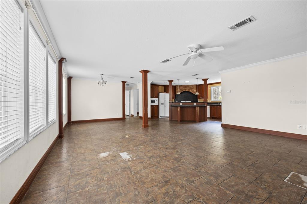 240 Swan Lake Road Melrose, FL 32666 - Photo 7 of 44 wooden floor in an empty room with a window