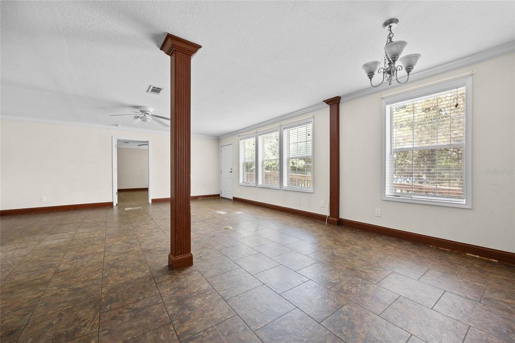 240 Swan Lake Road Melrose, FL 32666 - Photo 8 of 44 a view of an empty room with windows