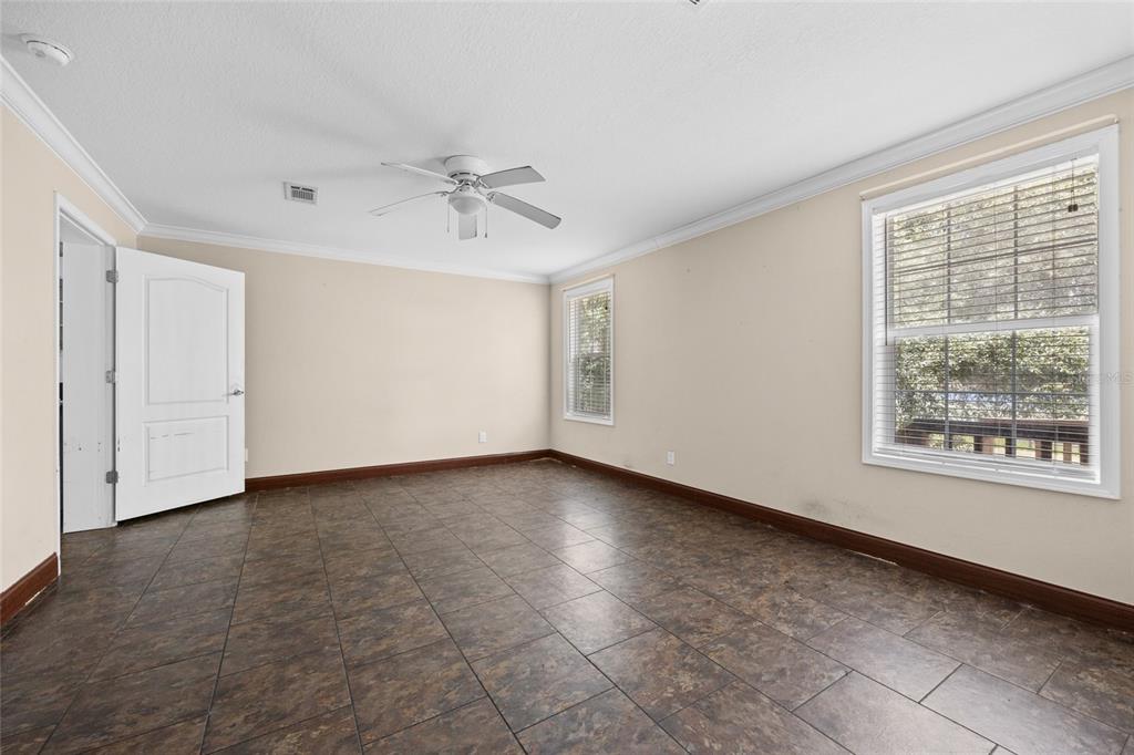 240 Swan Lake Road Melrose, FL 32666 - Photo 9 of 44 a view of an empty room with a window