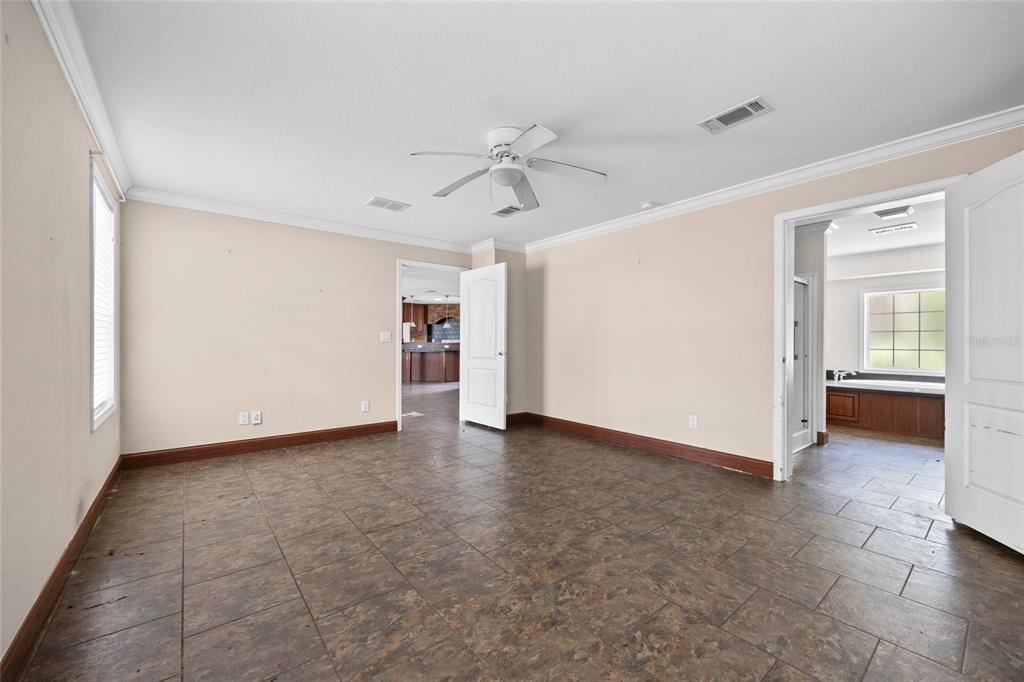 240 Swan Lake Road Melrose, FL 32666 - Photo 10 of 44 an empty room with closet and windows