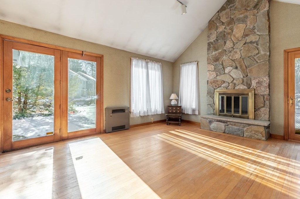 524 South Border Road Winchester, MA 01890 - Photo 14 of 24 a view of a livingroom with an empty space and a fireplace