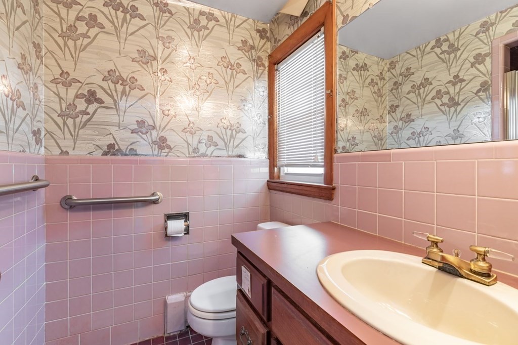 524 South Border Road Winchester, MA 01890 - Photo 18 of 24 a bathroom with a granite countertop sink and a toilet