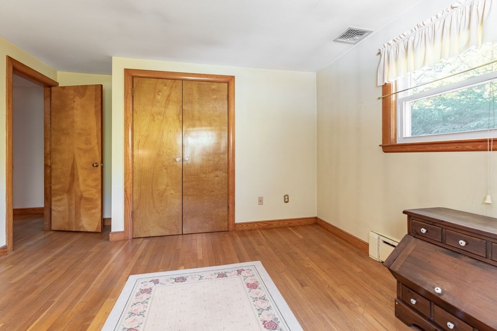 524 South Border Road Winchester, MA 01890 - Photo 19 of 24 an empty room with wooden floor and windows