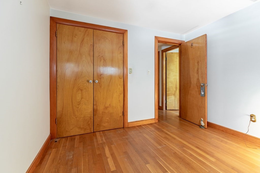 524 South Border Road Winchester, MA 01890 - Photo 20 of 24 an empty room with wooden floor and closet