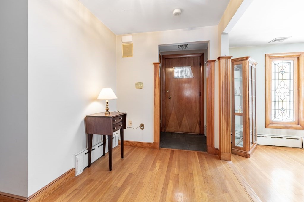 524 South Border Road Winchester, MA 01890 - Photo 2 of 24 a view of a room with wooden floor lounge chair and windows