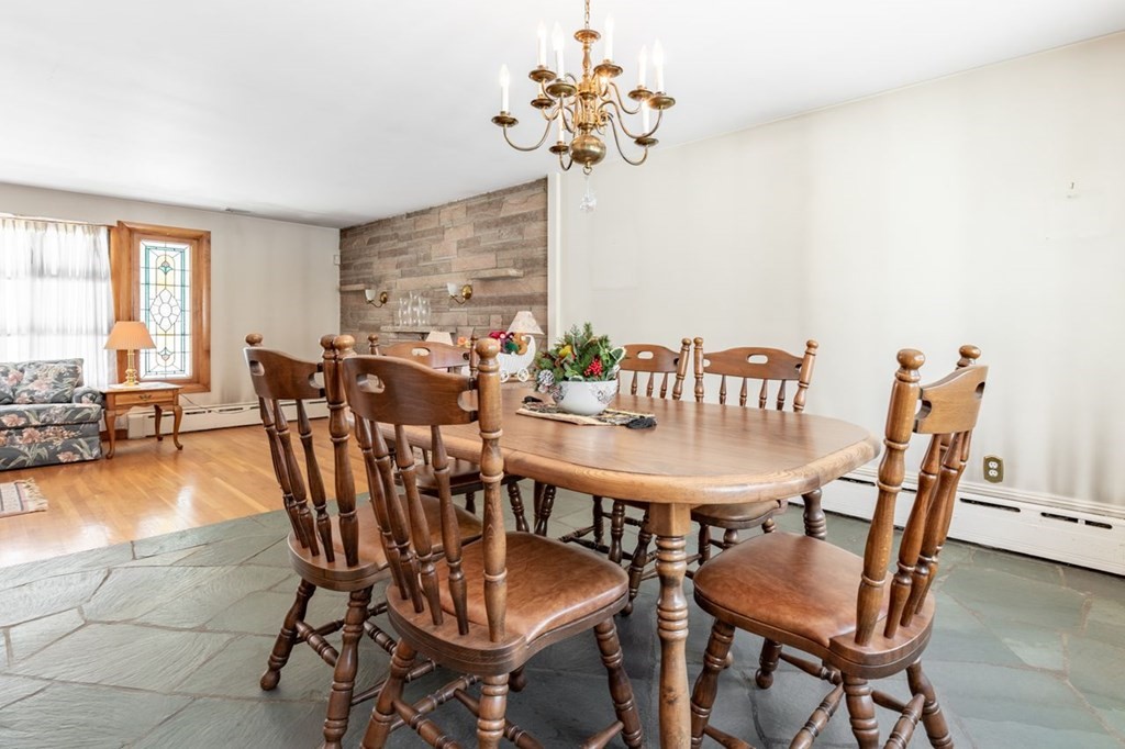 524 South Border Road Winchester, MA 01890 - Photo 7 of 24 a view of a dining room with furniture window and wooden floor