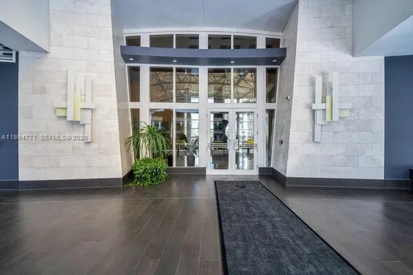 a view of front door of a house with a porch