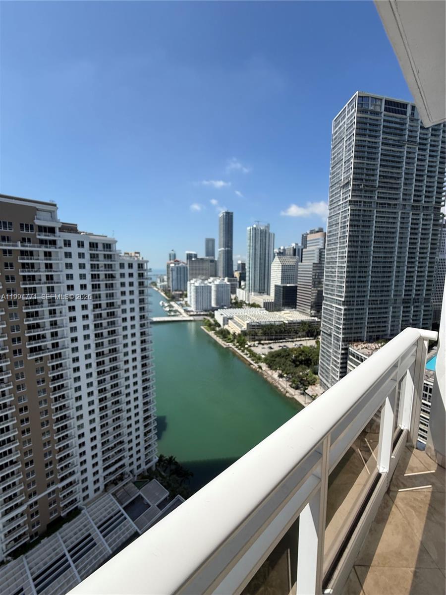 901 Brickell Key Boulevard, Unit 3102 Miami, FL 33131 - Photo 54 of 56 a view of a balcony with a floor to ceiling windows