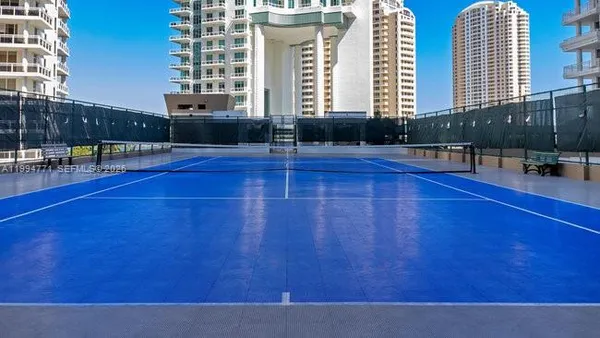 a view of a swimming pool with chairs