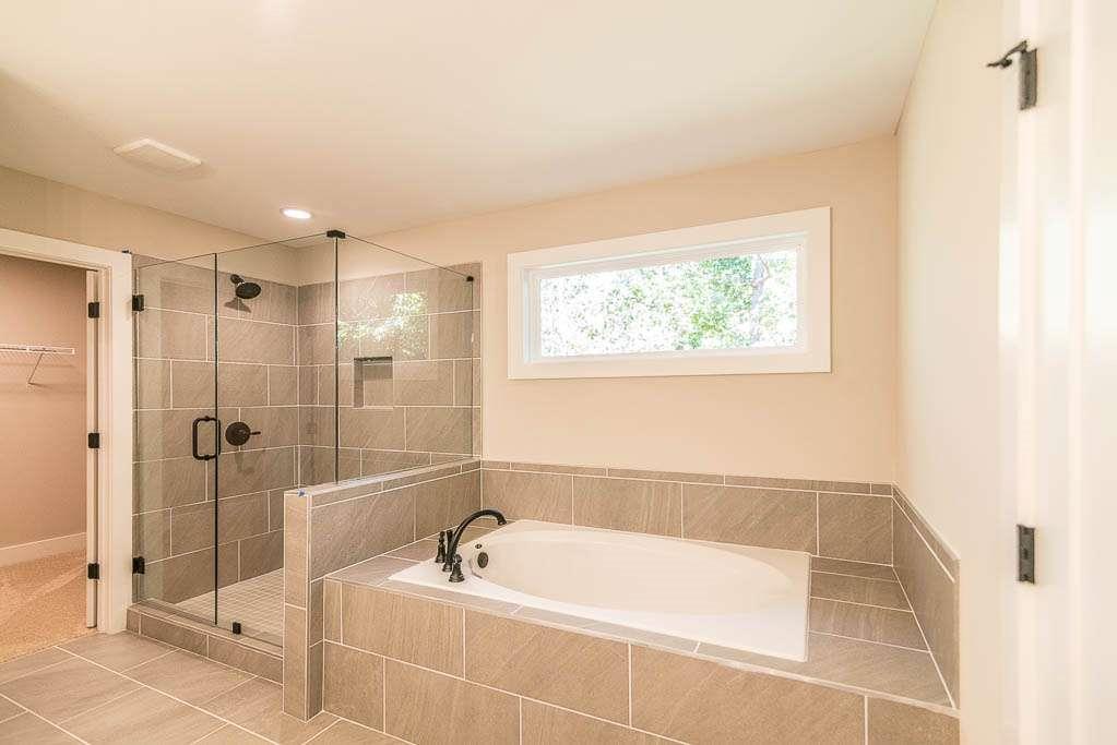2462 Waldrop Ridge Court Decatur, GA 30034 - Photo 11 of 20 a bathroom with a bathtub and a shower