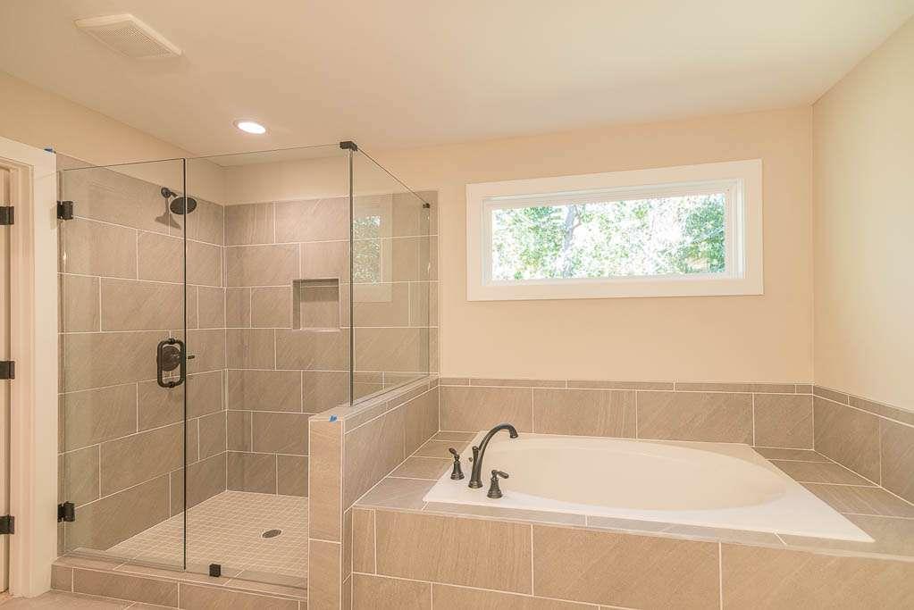 2462 Waldrop Ridge Court Decatur, GA 30034 - Photo 12 of 20 a bathroom with a tub and shower