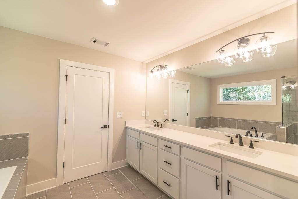2462 Waldrop Ridge Court Decatur, GA 30034 - Photo 13 of 20 a bathroom with double sink and a mirror
