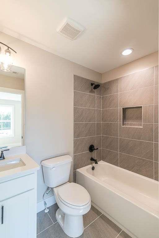 2462 Waldrop Ridge Court Decatur, GA 30034 - Photo 16 of 20 a bathroom with a bathtub shower sink mirror and toilet