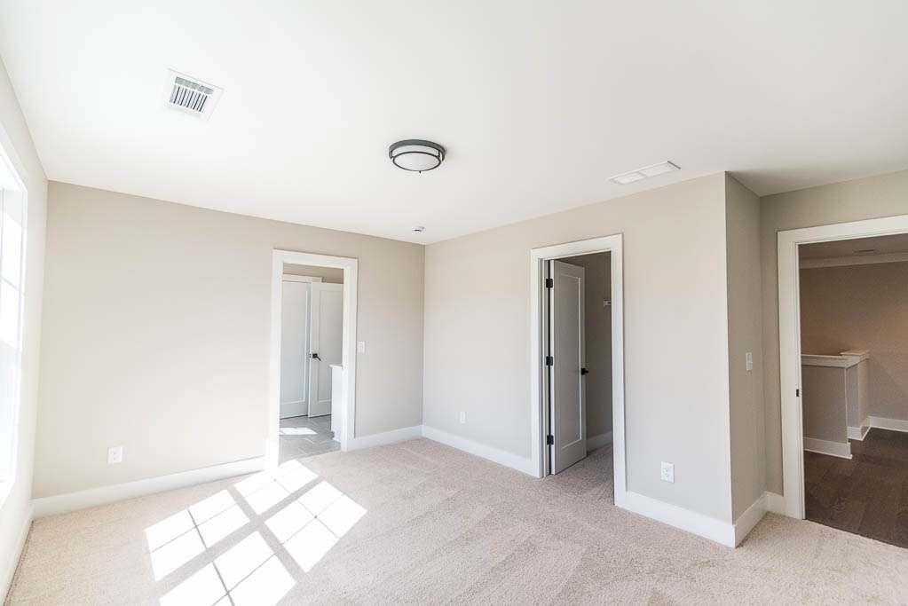 2462 Waldrop Ridge Court Decatur, GA 30034 - Photo 17 of 20 an empty room with windows and closet