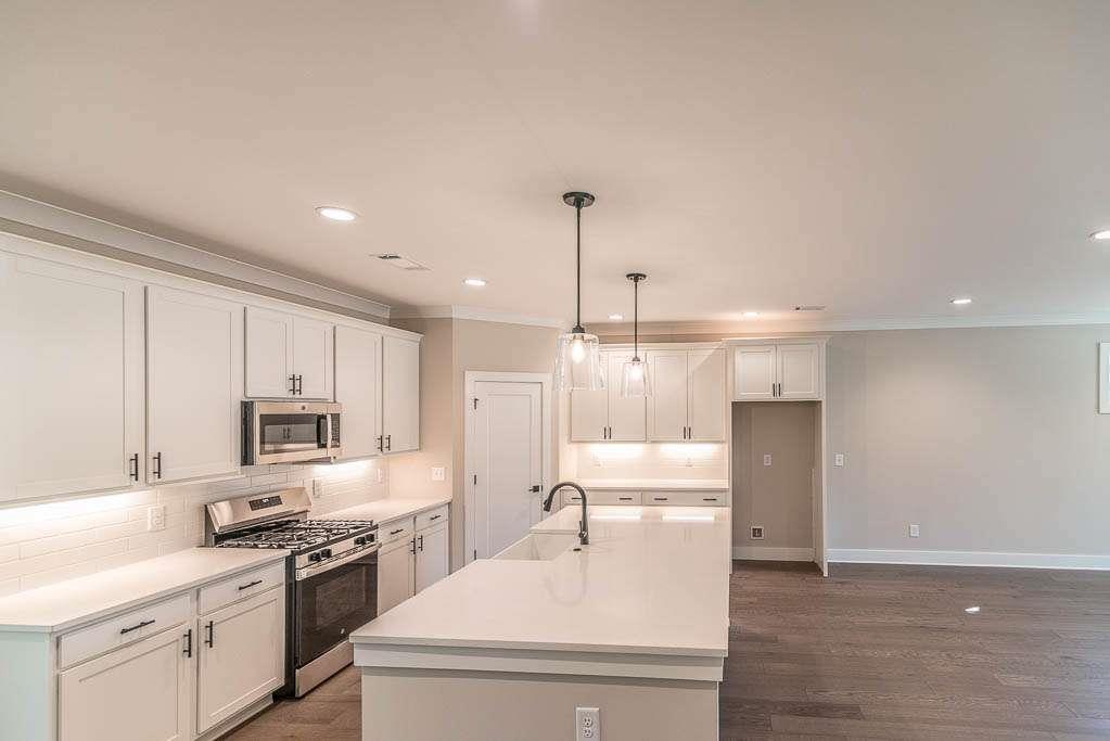 2462 Waldrop Ridge Court Decatur, GA 30034 - Photo 19 of 20 a kitchen with a sink stainless steel appliances and cabinets